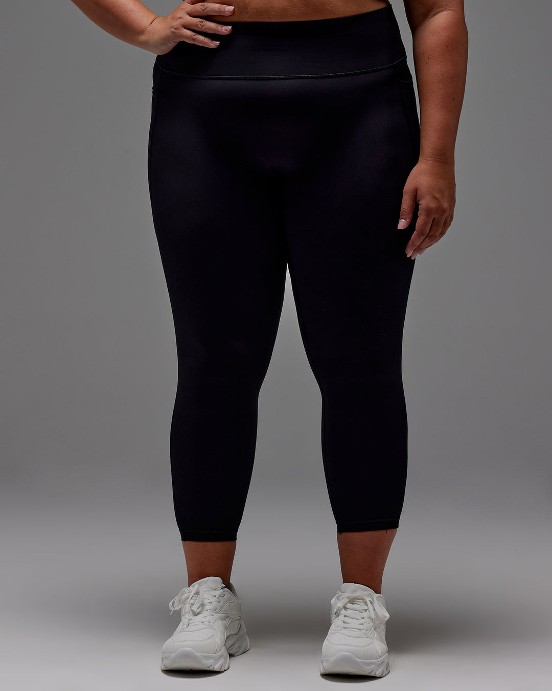 Woman wearing Fusion 7/8 Length Tight With Pockets in Black | Model:Jordie | Size:2XL