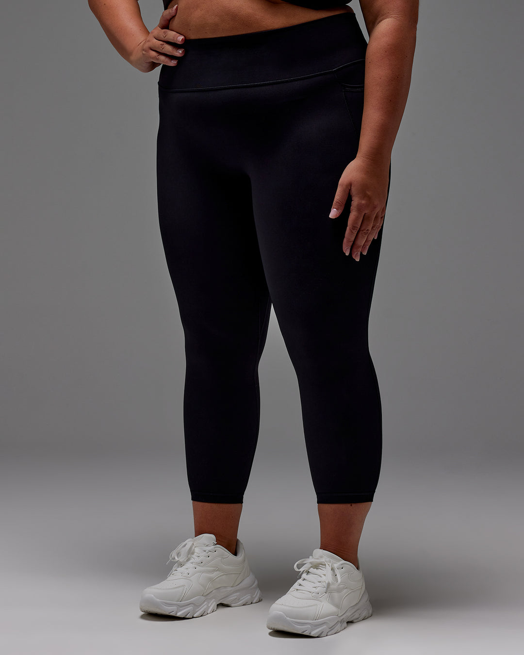 Woman wearing Fusion 7/8 Length Tight With Pockets in Black | Model:Jordie | Size:2XL