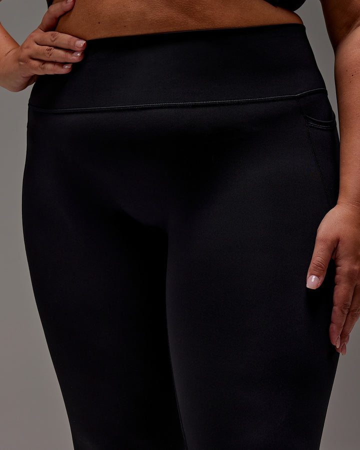 Woman wearing Fusion 7/8 Length Tight With Pockets in Black | Model:Jordie | Size:2XL
