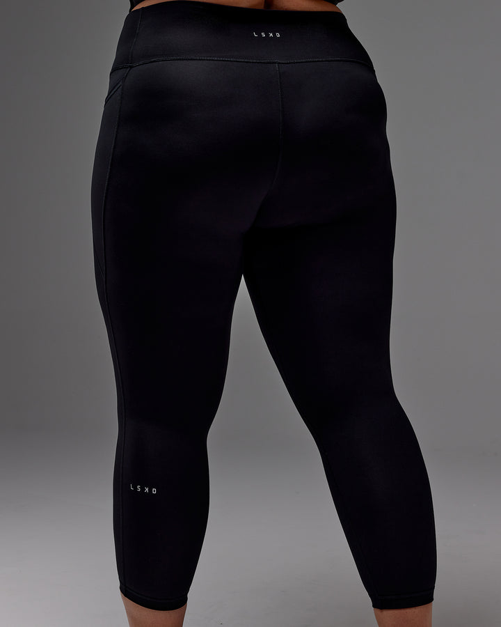 Woman wearing Fusion 7/8 Length Tight With Pockets in Black | Model:Jordie | Size:2XL
