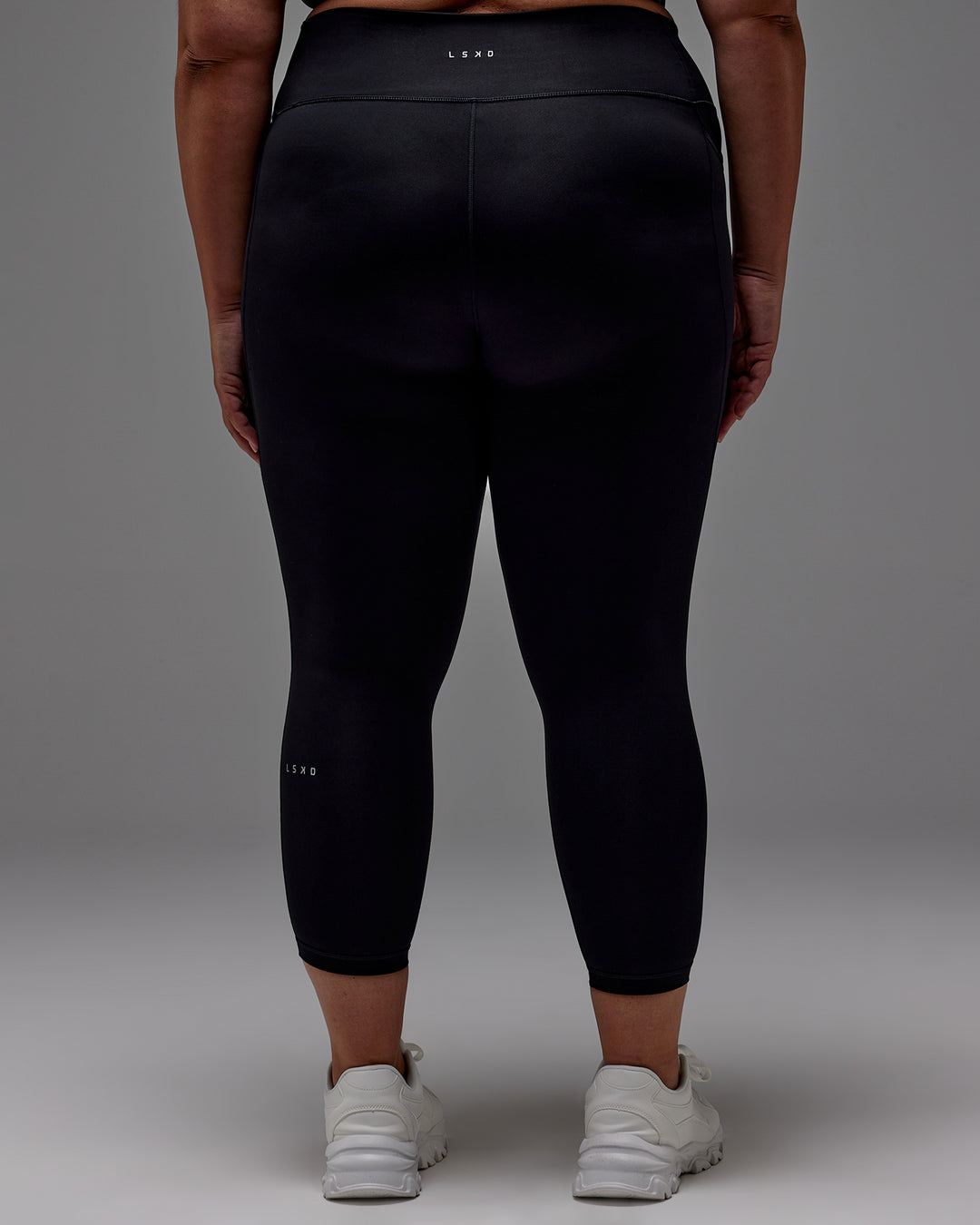 Woman wearing Fusion 7/8 Length Tight With Pockets in Black | Model:Jordie | Size:2XL