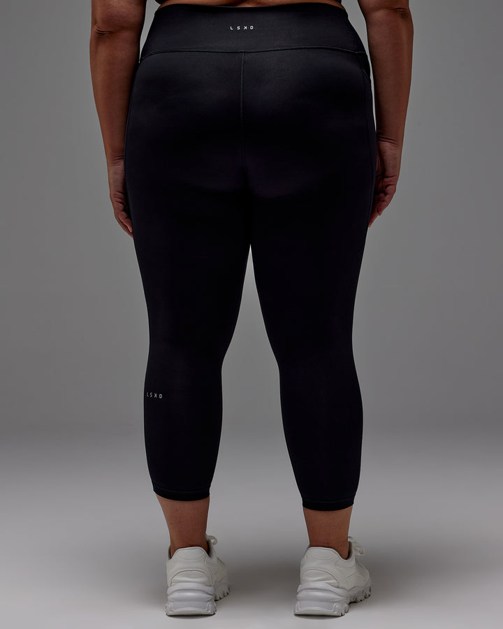 Woman wearing Fusion 7/8 Length Tight With Pockets in Black | Model:Jordie | Size:2XL
