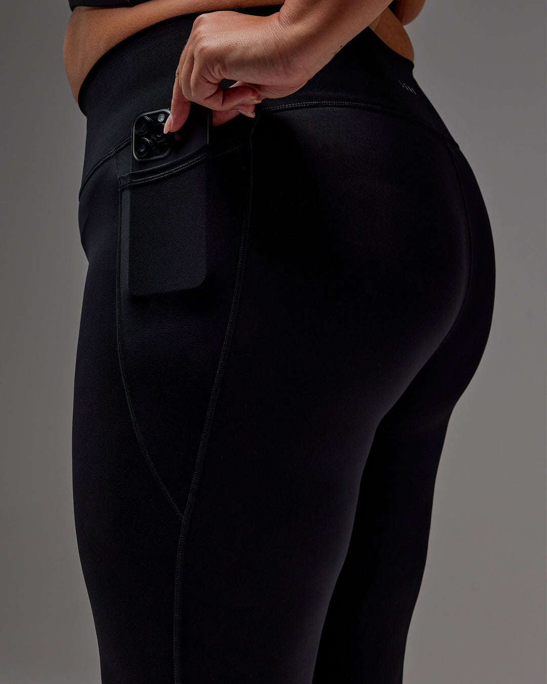 Woman wearing Fusion 7/8 Length Tight With Pockets in Black | Model:Jordie | Size:2XL