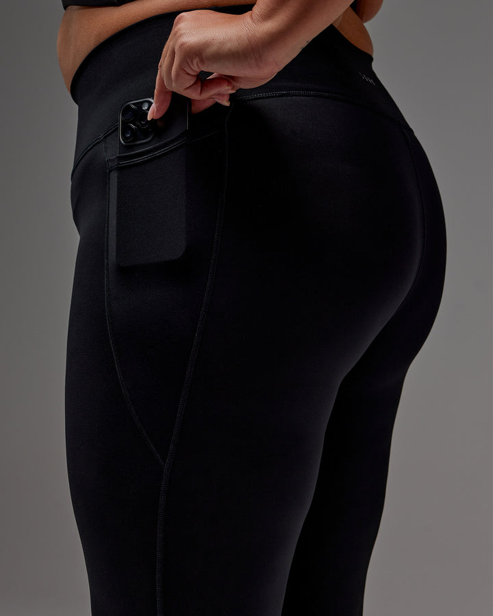 Woman wearing Fusion 7/8 Length Tight With Pockets in Black | Model:Jordie | Size:2XL
