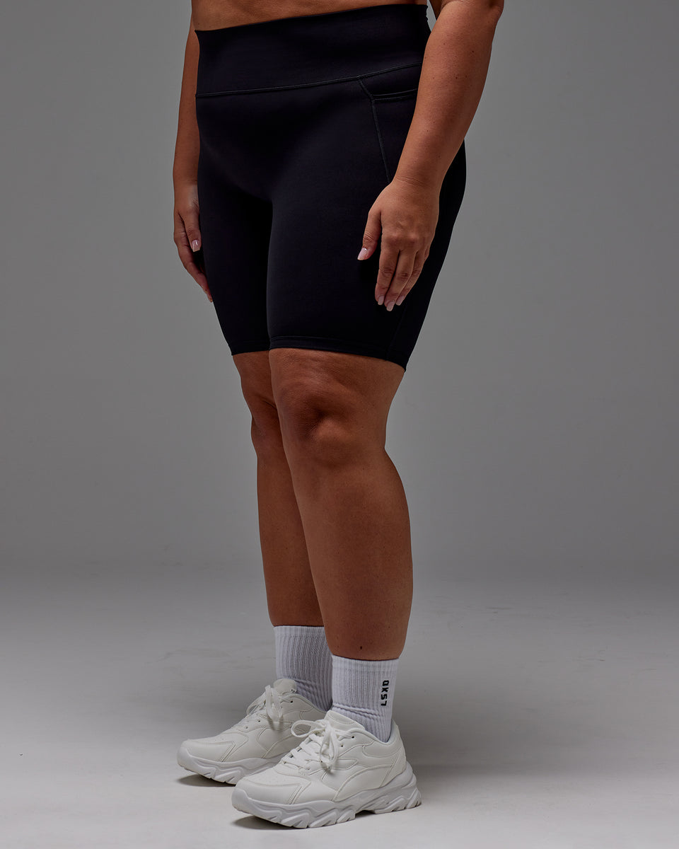 Woman wearing Fusion Bike Short With Pockets in Black | Model:Jordie | Size:2XL