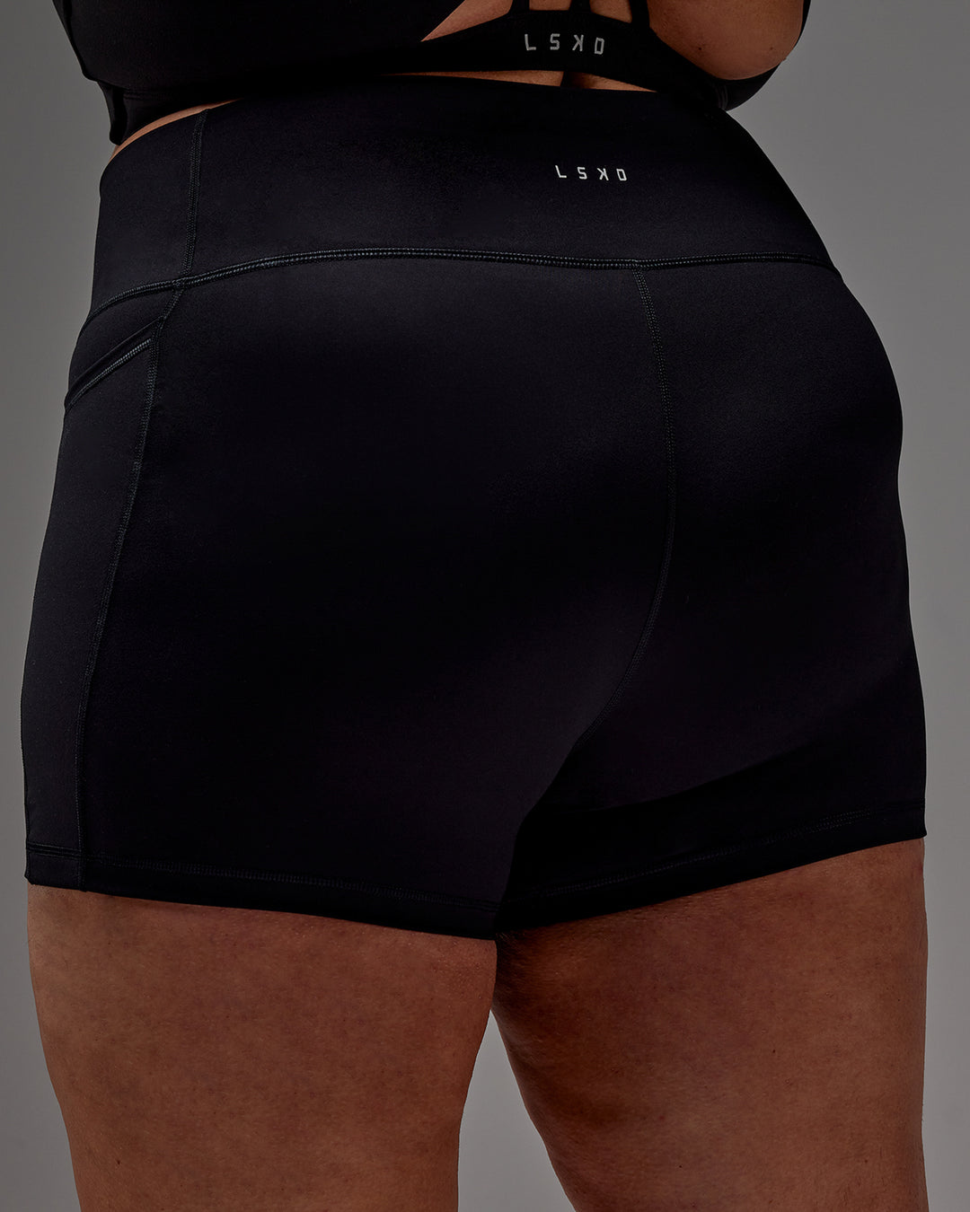 Woman wearing Fusion X-Short Tight With Pockets in Black | Model:Jordie | Size:2XL