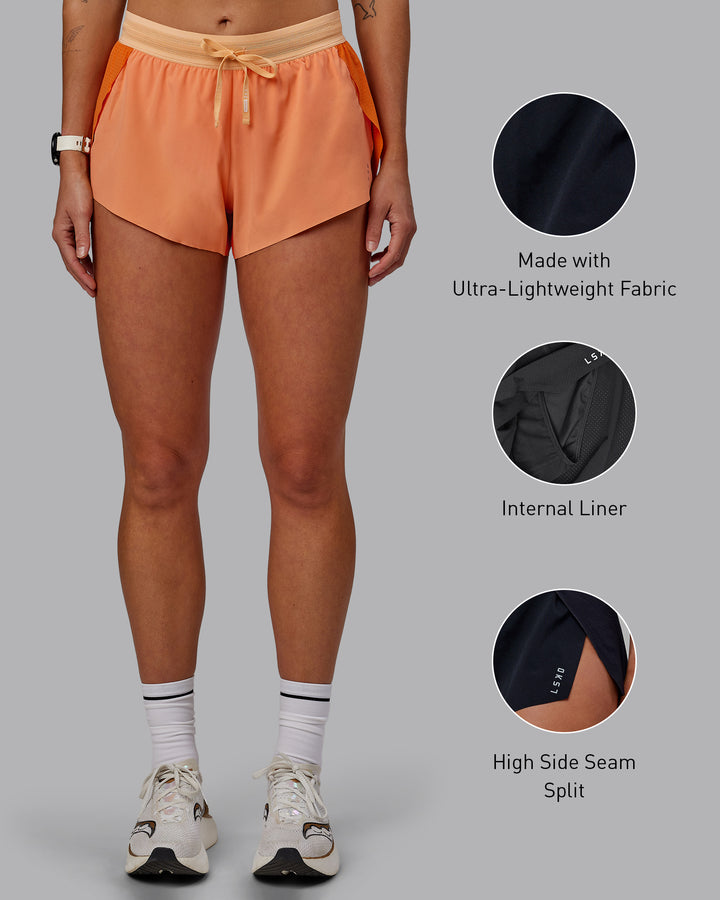 Woman wearing Accelerate 3&quot; Run Shorts - Cantaloupe Colourblock
