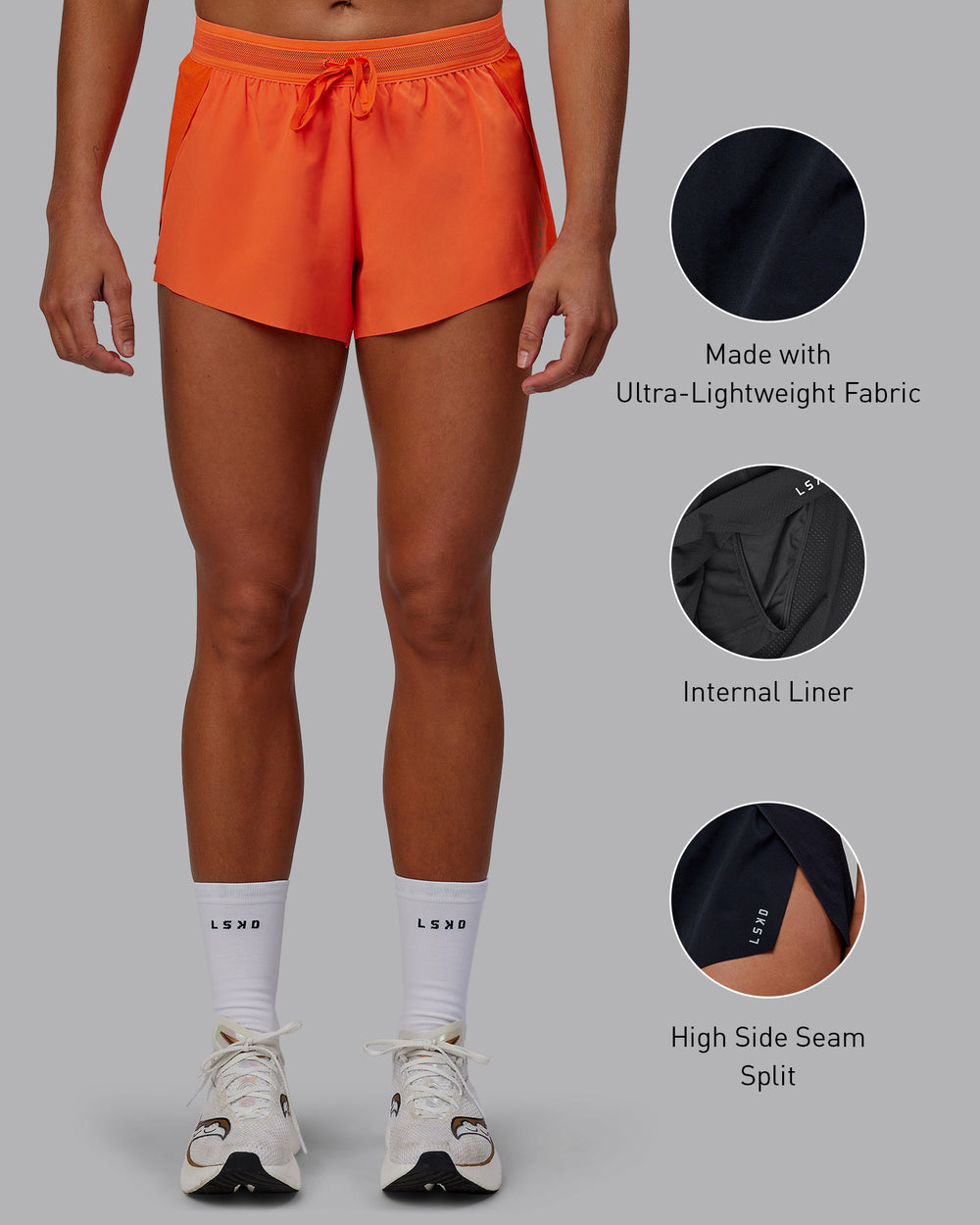 Woman wearing Accelerate Run Shorts - Ultra Orange