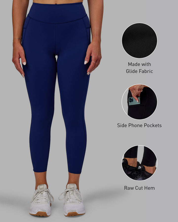 Woman wearing Elite 7/8 Length Leggings - Midnight Blue
