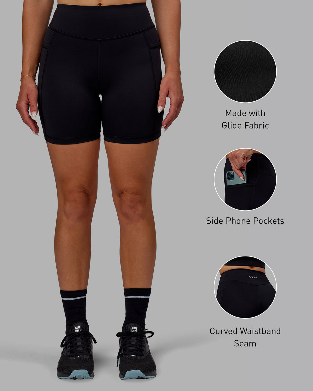 Woman wearing Elite Mid-Length Shorts - Black