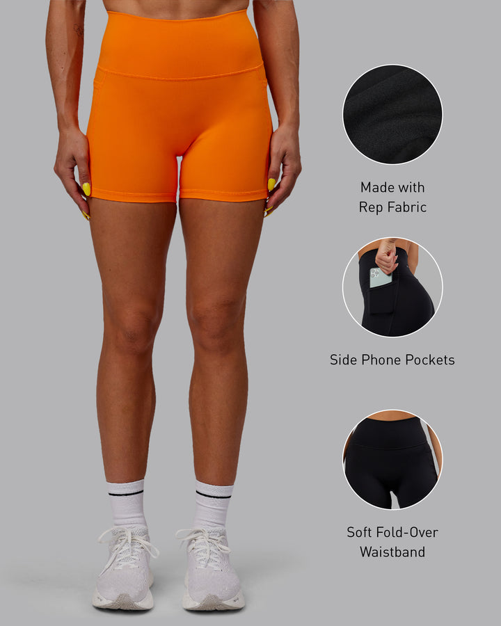 Woman wearing Fusion X-Short Tights - Vibrant Orange
