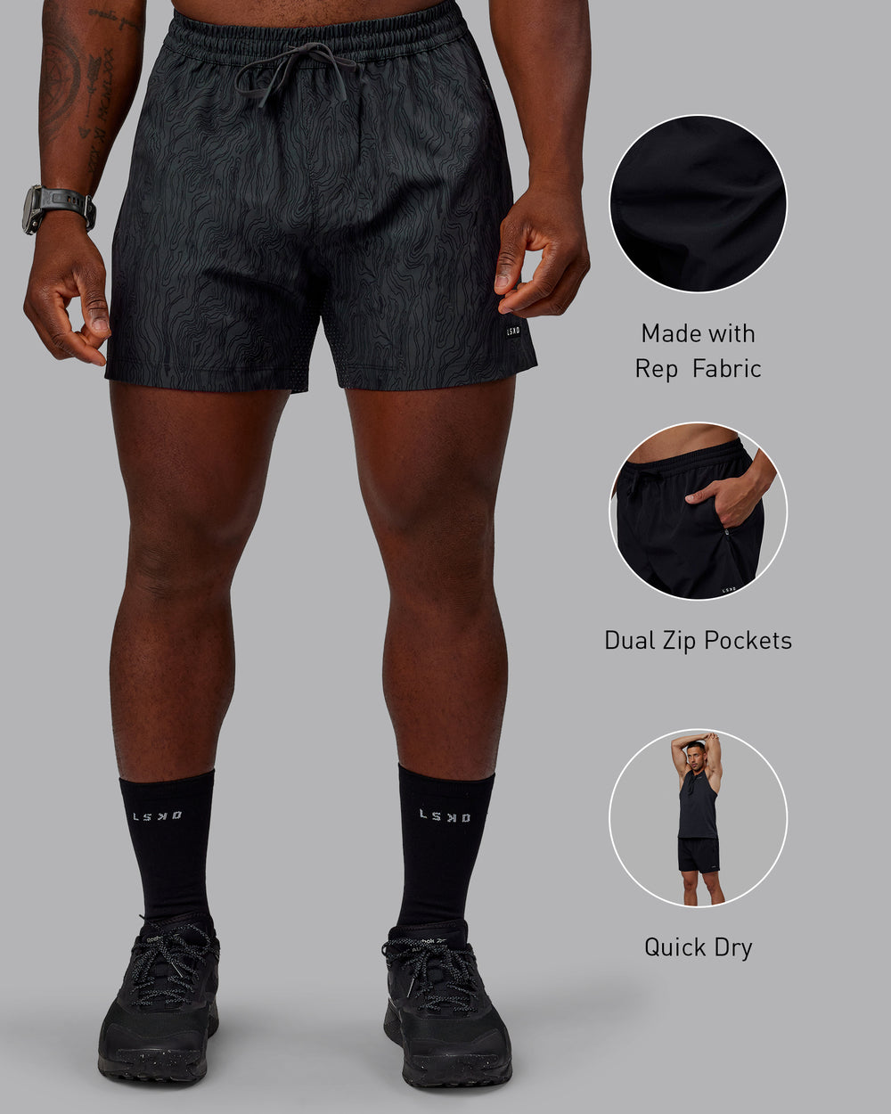 Man wearing Rep 5" Performance Shorts - Topographic Black 