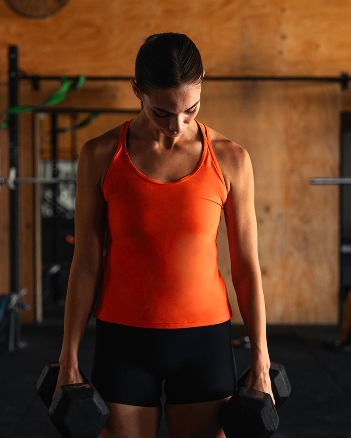 Woman wearing Apex Lightweight Performance Tank - Grenadine
