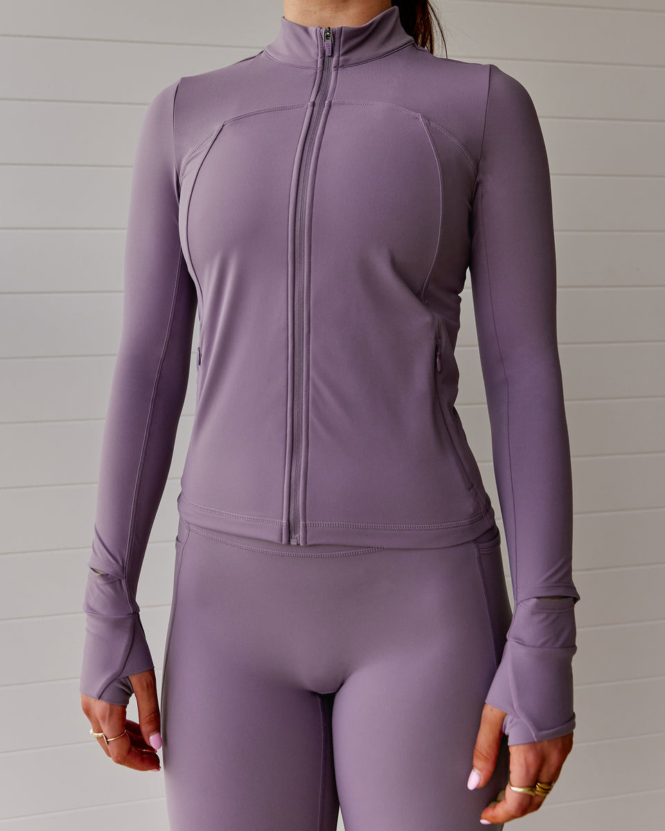 Woman wearing Aspire Jacket - Purple Sage