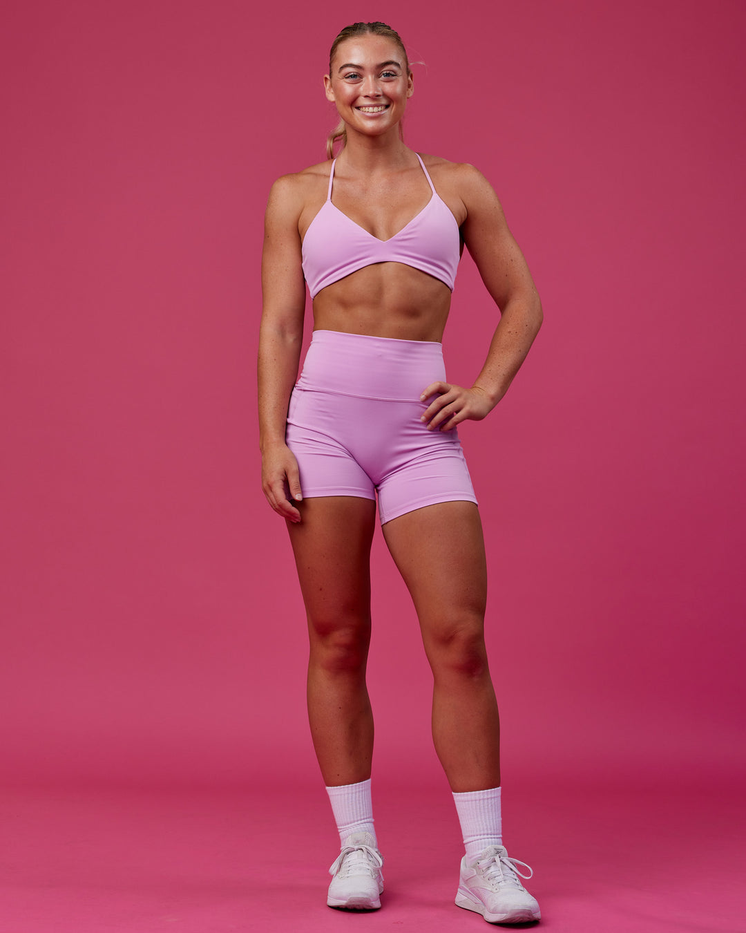 Woman wearing Aura Sports Bra - Pastel Orchid