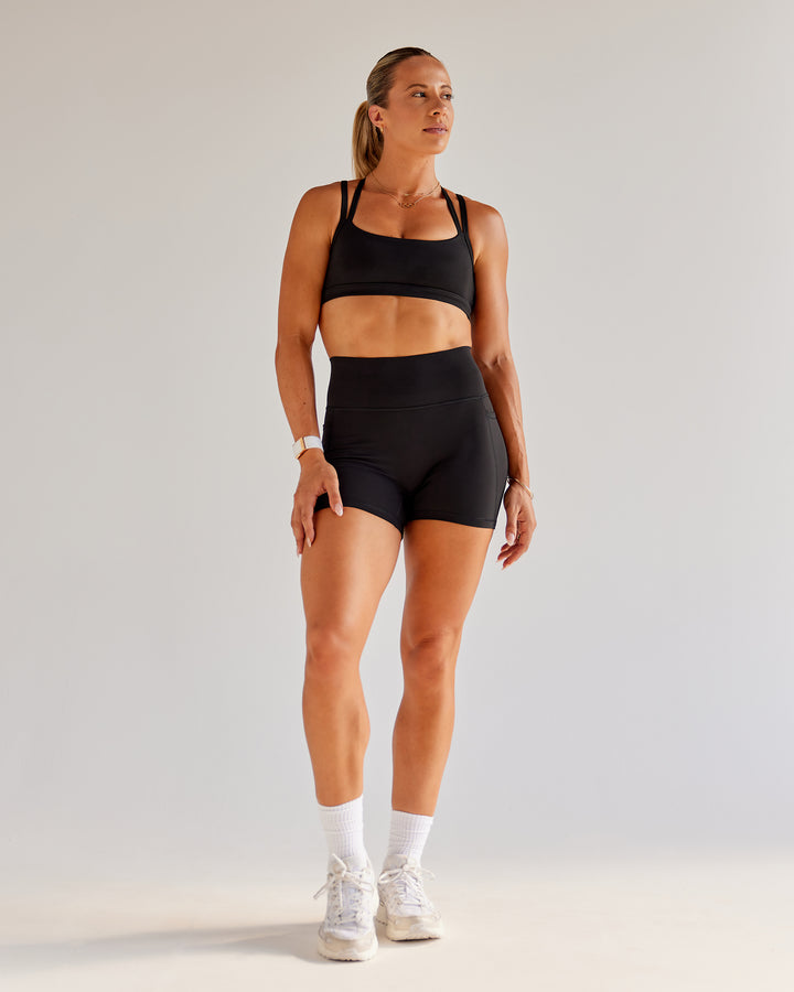 Woman wearing Bree Masters Velocity Sports Bra - Black
