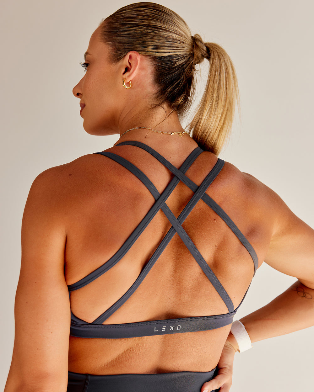 Woman wearing Bree Masters Velocity Sports Bra - Stormy