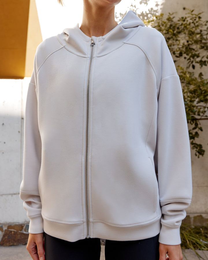 Woman wearing Elevate SoftTouch Zip Through Hoodie - Clay-Clay
