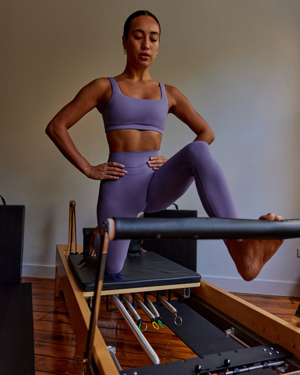 Woman wearing Elevation Sports Bra - Dahlia Purple