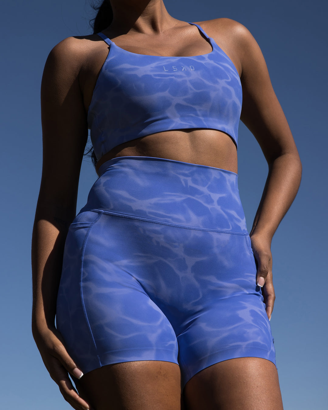 Woman wearing Elixir Mid Short Tights with Pockets - Tranquil-Power Cobalt