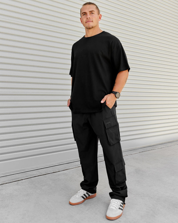 Man wearing Energy Stretch Relaxed Fit Cargo Pants - Black
