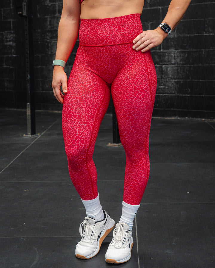 Woman wearing Fusion 7/8 Length Tights - Red Vitality Print
