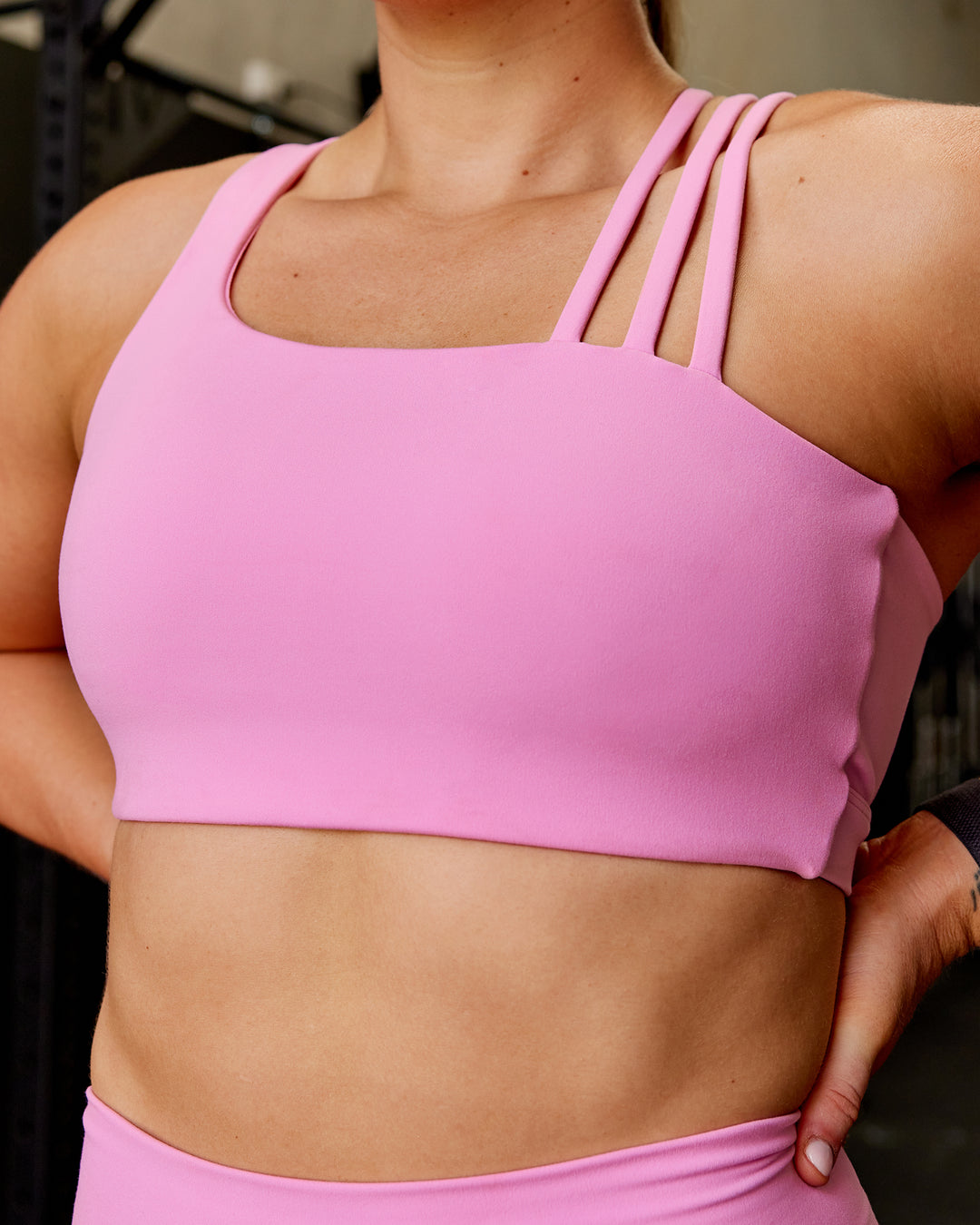 Woman wearing Galvanise Sports Bra - Spark Pink