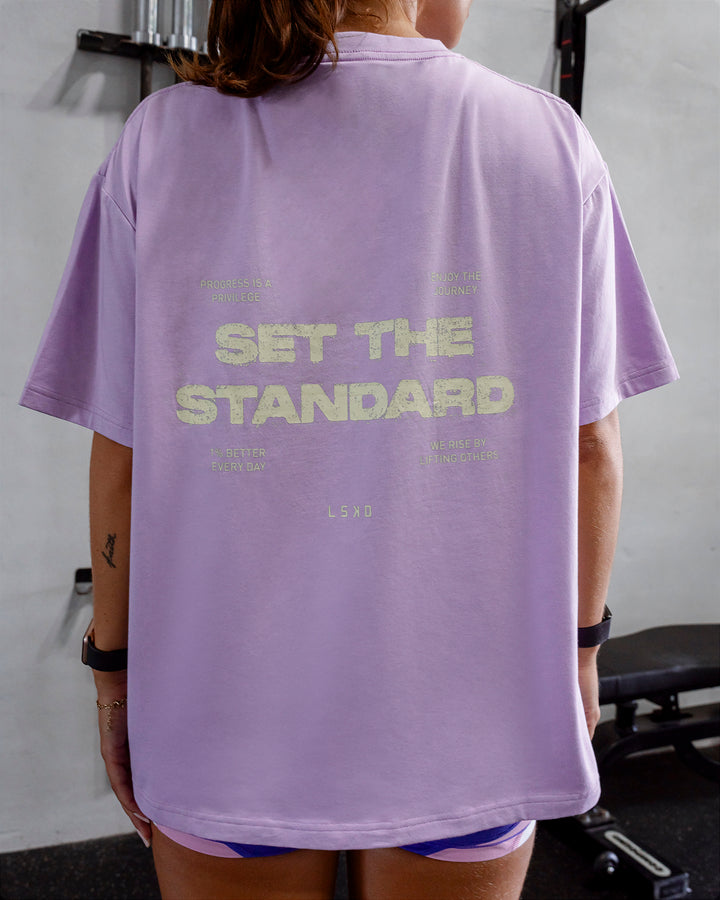 Woman wearing Go-To Set The Standard FLXCotton Oversized Tee - Pale Lilac-Elfin Yellow
