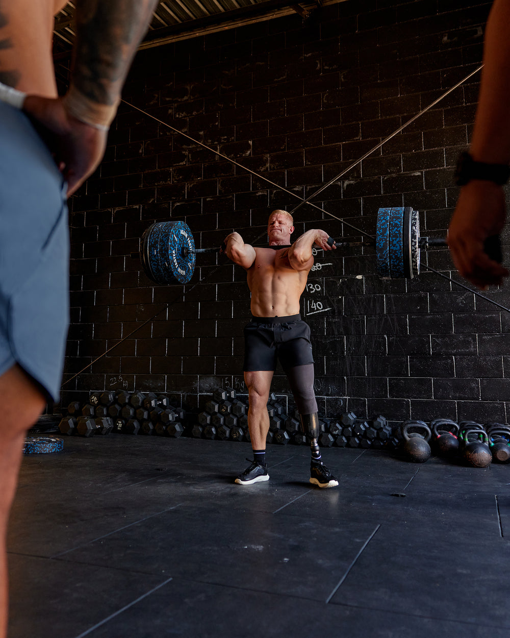 Man wearing Lift 6" Performance Shorts - Black-Reflective