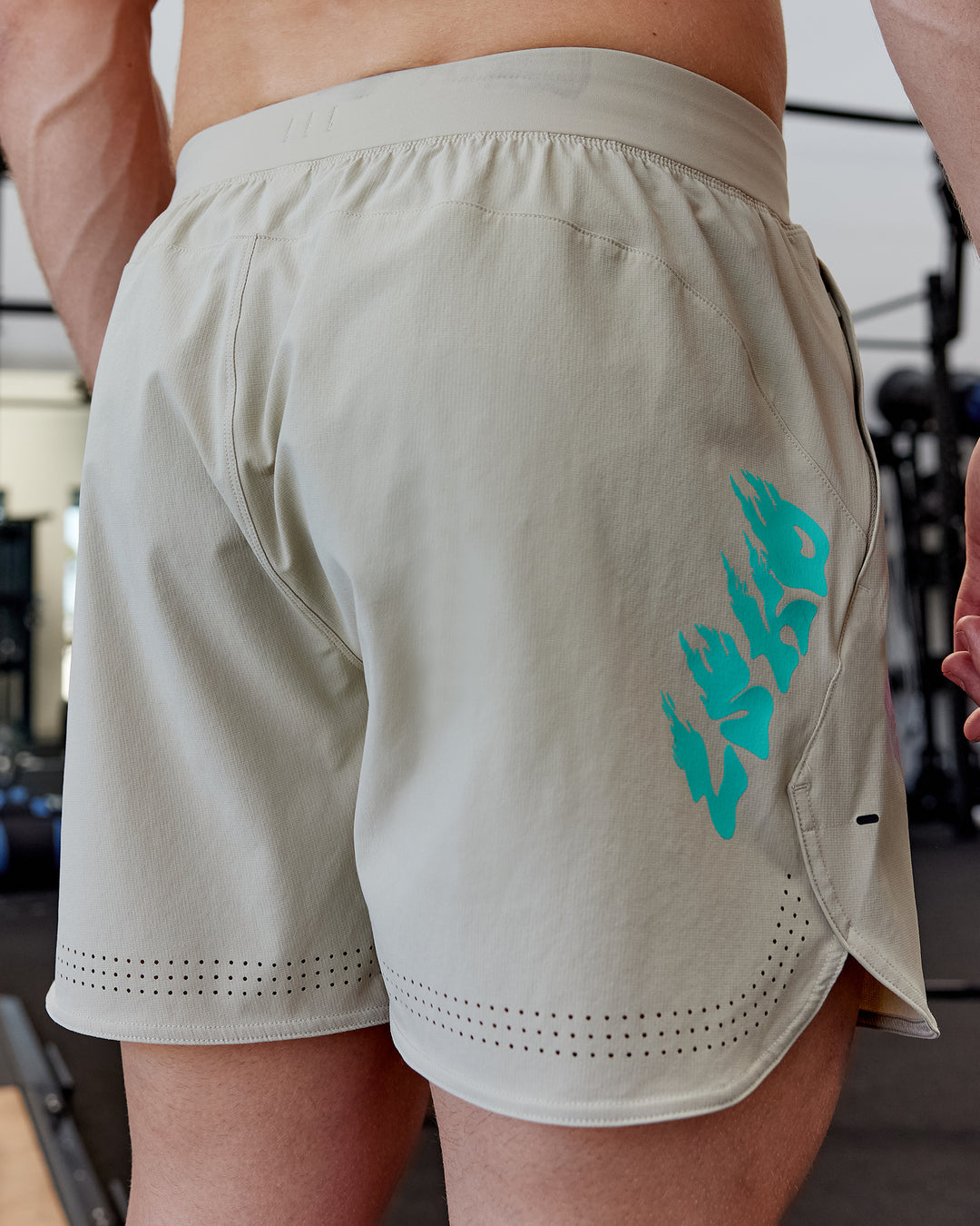 Man wearing Lift 6&quot; Performance Shorts - Sand-So Cal 24