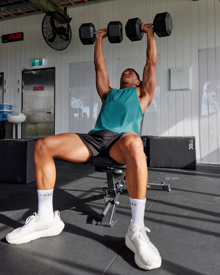 Man wearing AeroFLX+ Seamless Muscle Tank - Blue Bird Marl
