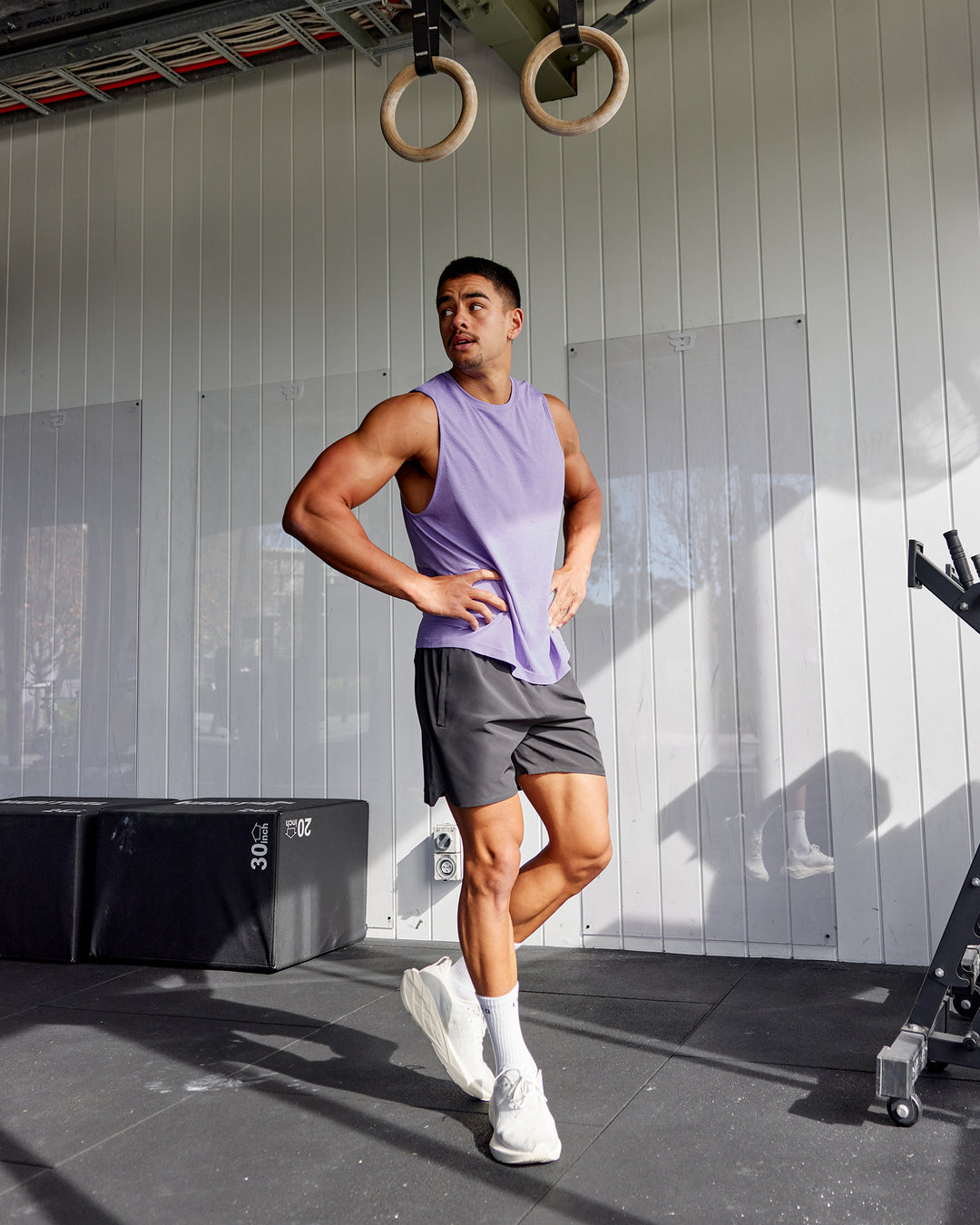 Man wearing AeroFLX+ Seamless Muscle Tank - Dahlia Purple Marl