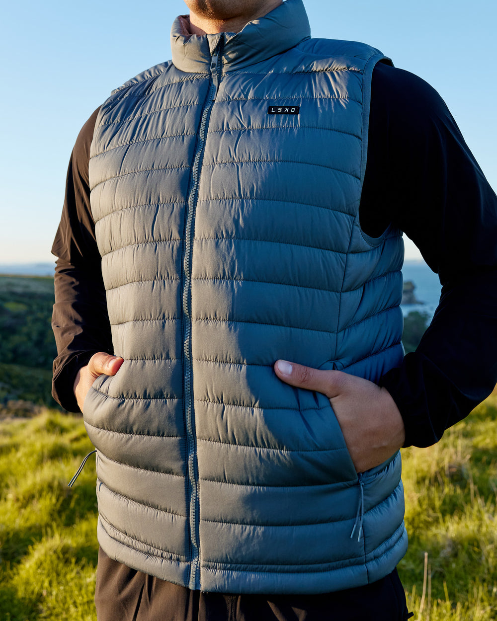 Man wearing All Day Puffer Vest - Storm