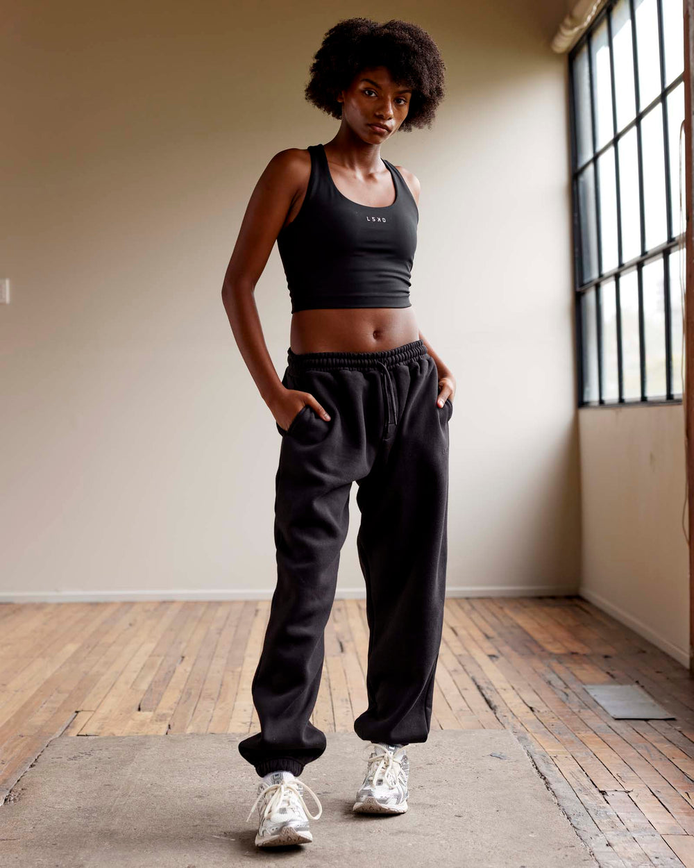 Woman wearing MVP Track Pants - Black-Black