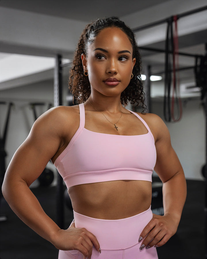 Woman wearing Momentum Sports Bra - Marshmallow
