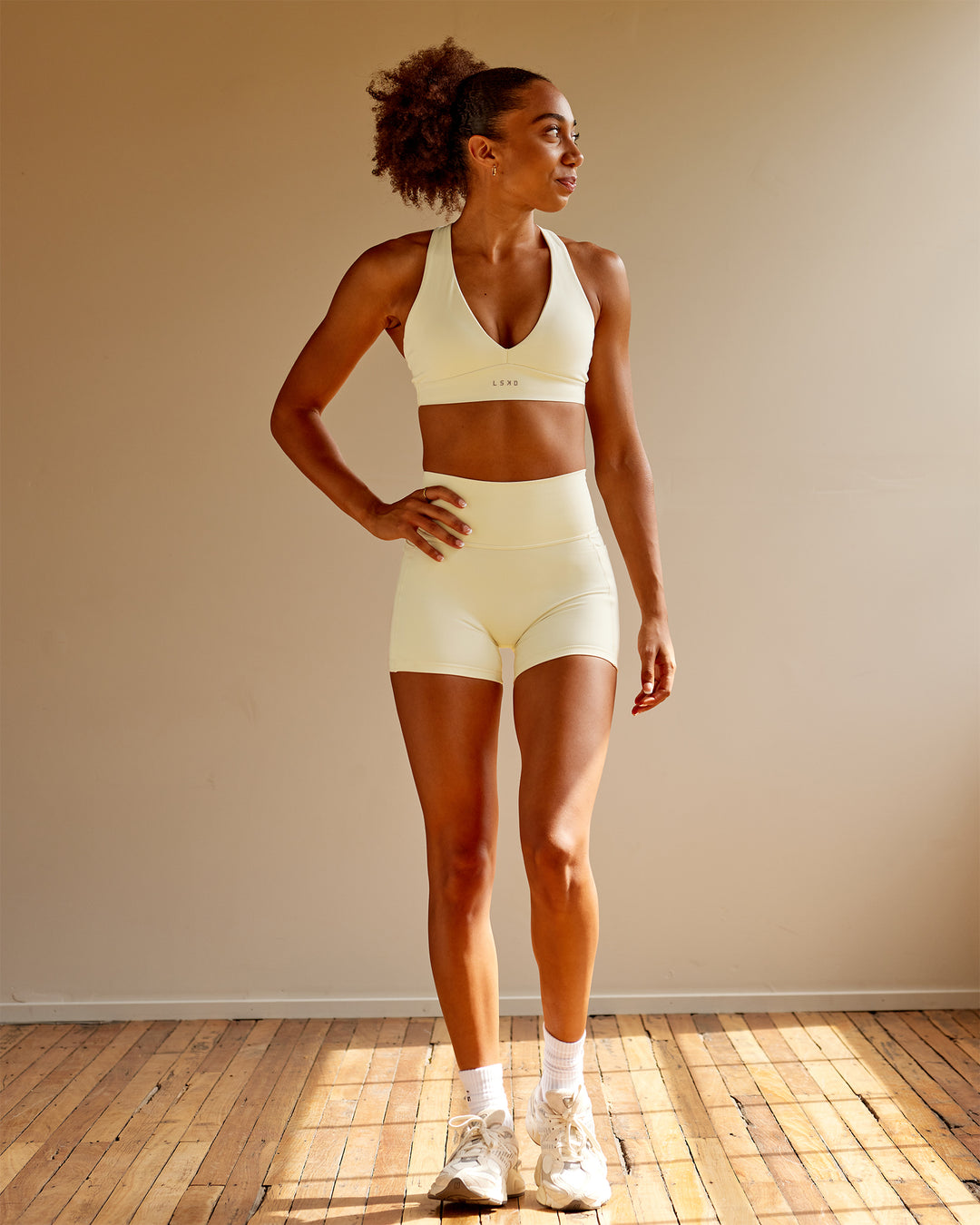 Woman wearing Poise Sports Bra - Ivory