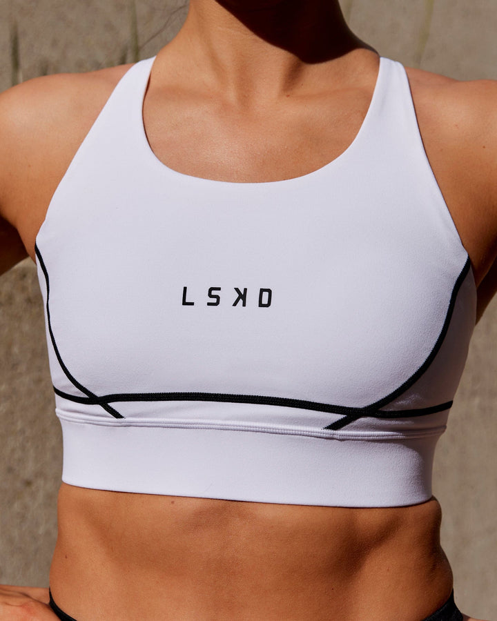 Woman wearing Pulse Sports Bra - White
