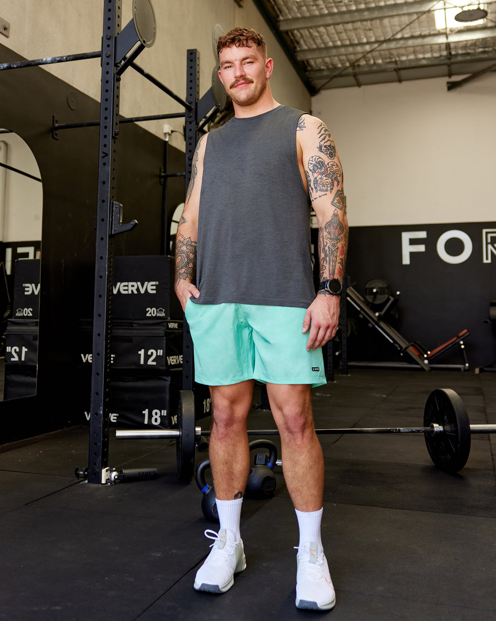 Man wearing Rep 7" Performance Shorts - Digital Camo Cockatoo