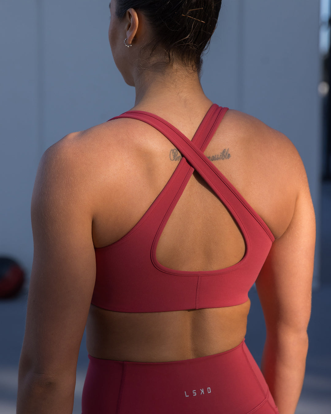 Woman wearing Stamina Sports Bra - Claret