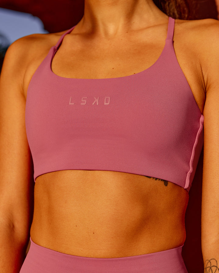 Woman wearing Twist Sports Bra - Mauve Haze
