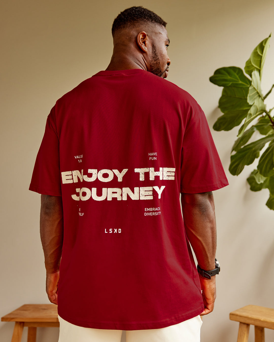 Man wearing Unisex Enjoy the Journey Value Series FLXCotton Tee Oversize - Cherry Red-Ivory