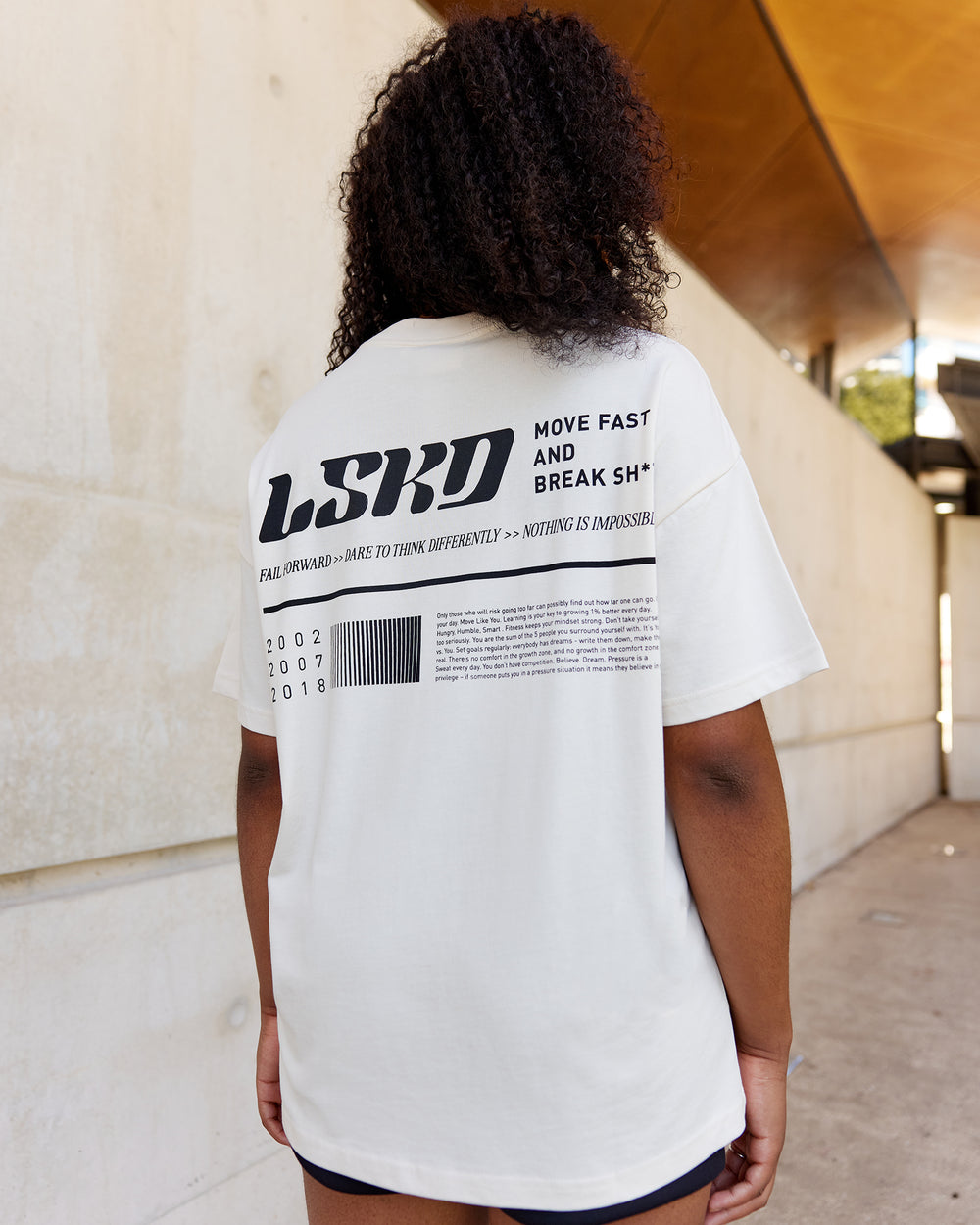 Woman wearing Unisex Fail Forward Heavyweight FLXCotton Tee Oversize - Off White-Black