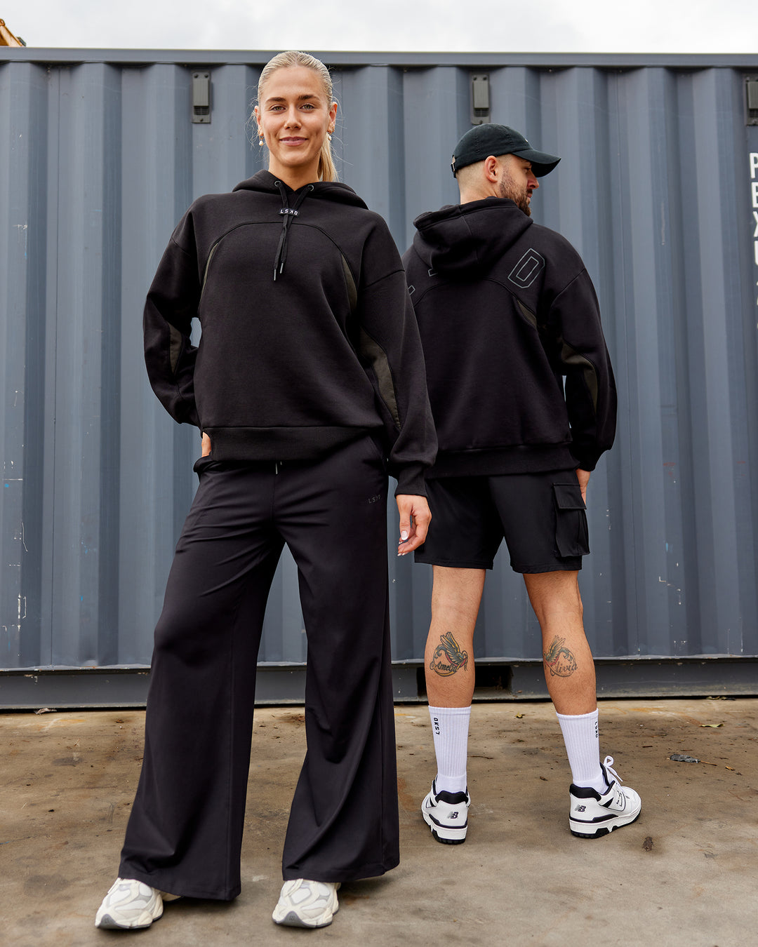 Duo wearing Unisex Y2K Concept Panel Hoodie - Black-Pirate Black