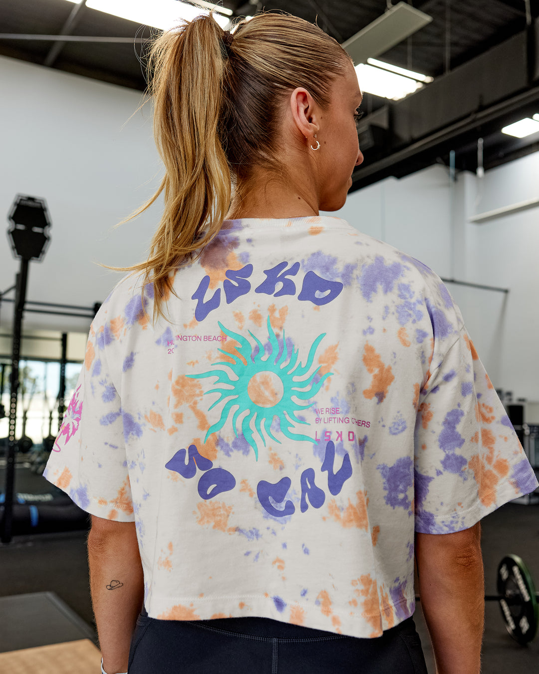 Woman wearing Washed Huntington 24 Cropped Heavyweight Tee - Tie Dye Tangerine-Dahlia Purple