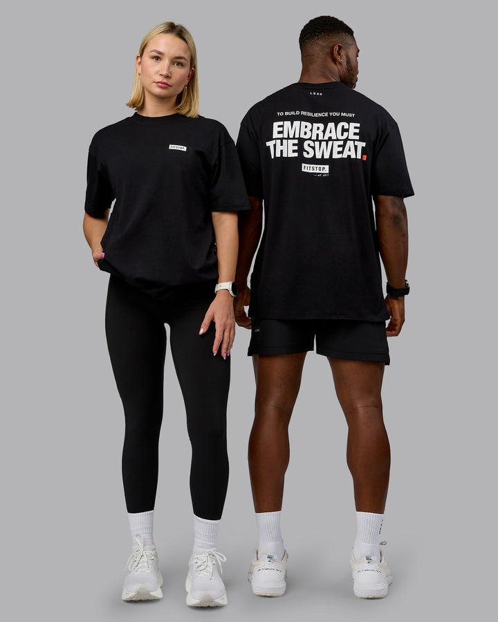 Duo wearing Fitstop Embrace the Sweat FLXCotton Oversized Tee in Black-White | Size:Duo
