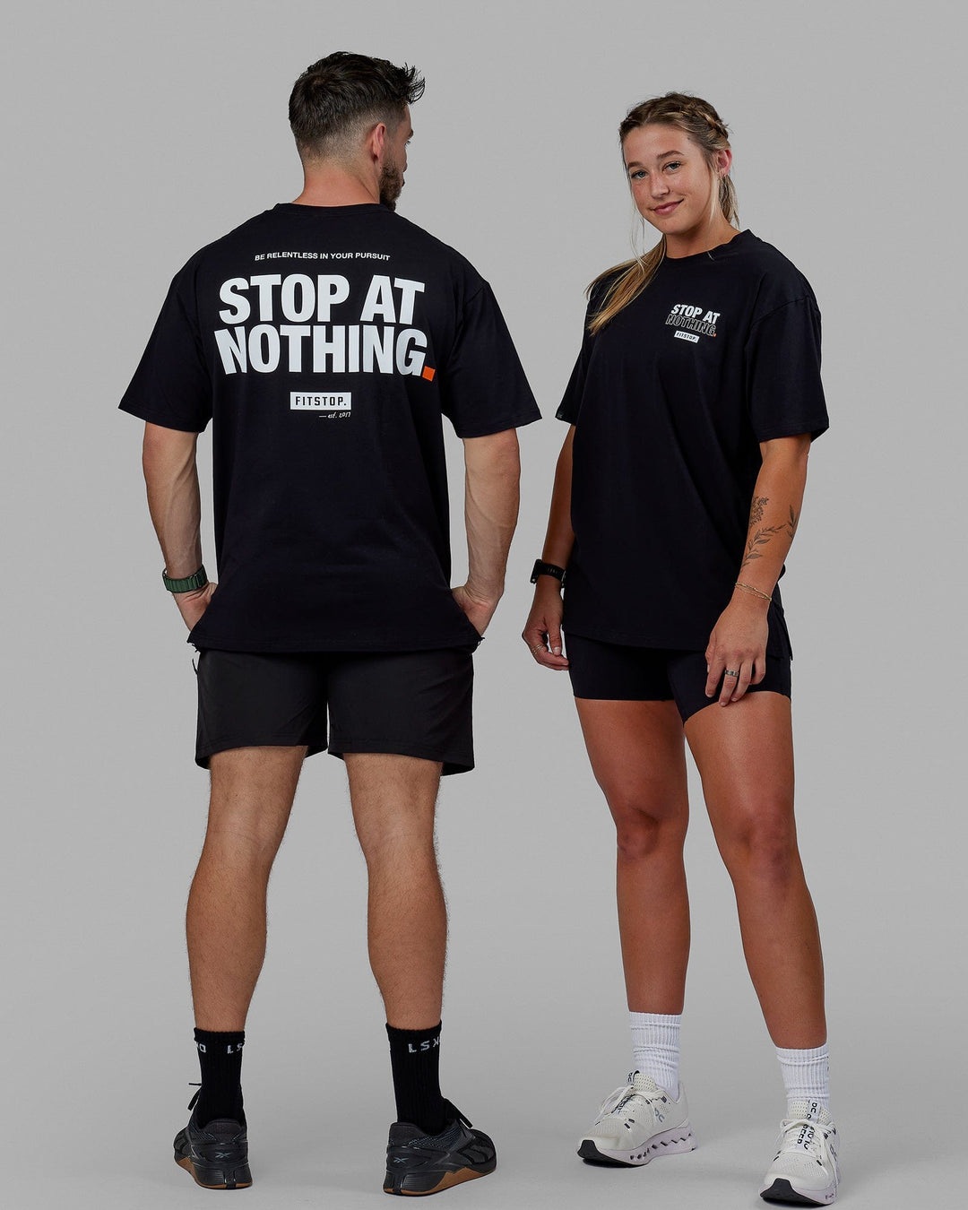 Duo wearing Unisex Fitstop Stop At Nothing Tee Oversize - Black-White