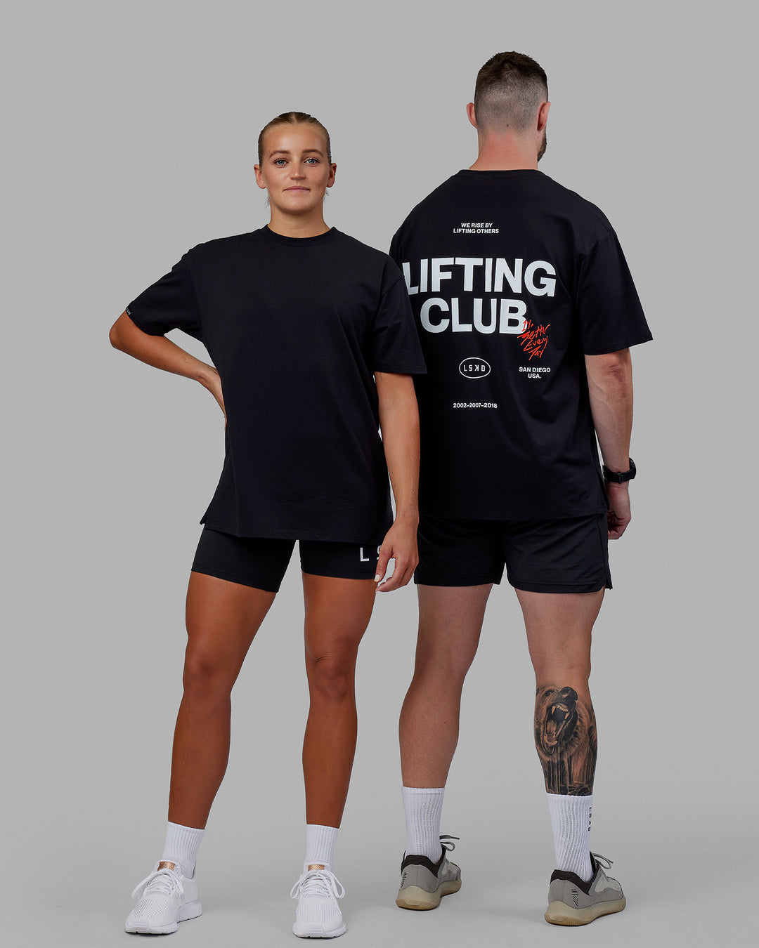 Duo wearing Unisex Lifting Club FLXCotton Tee Oversize - Black-White-Red