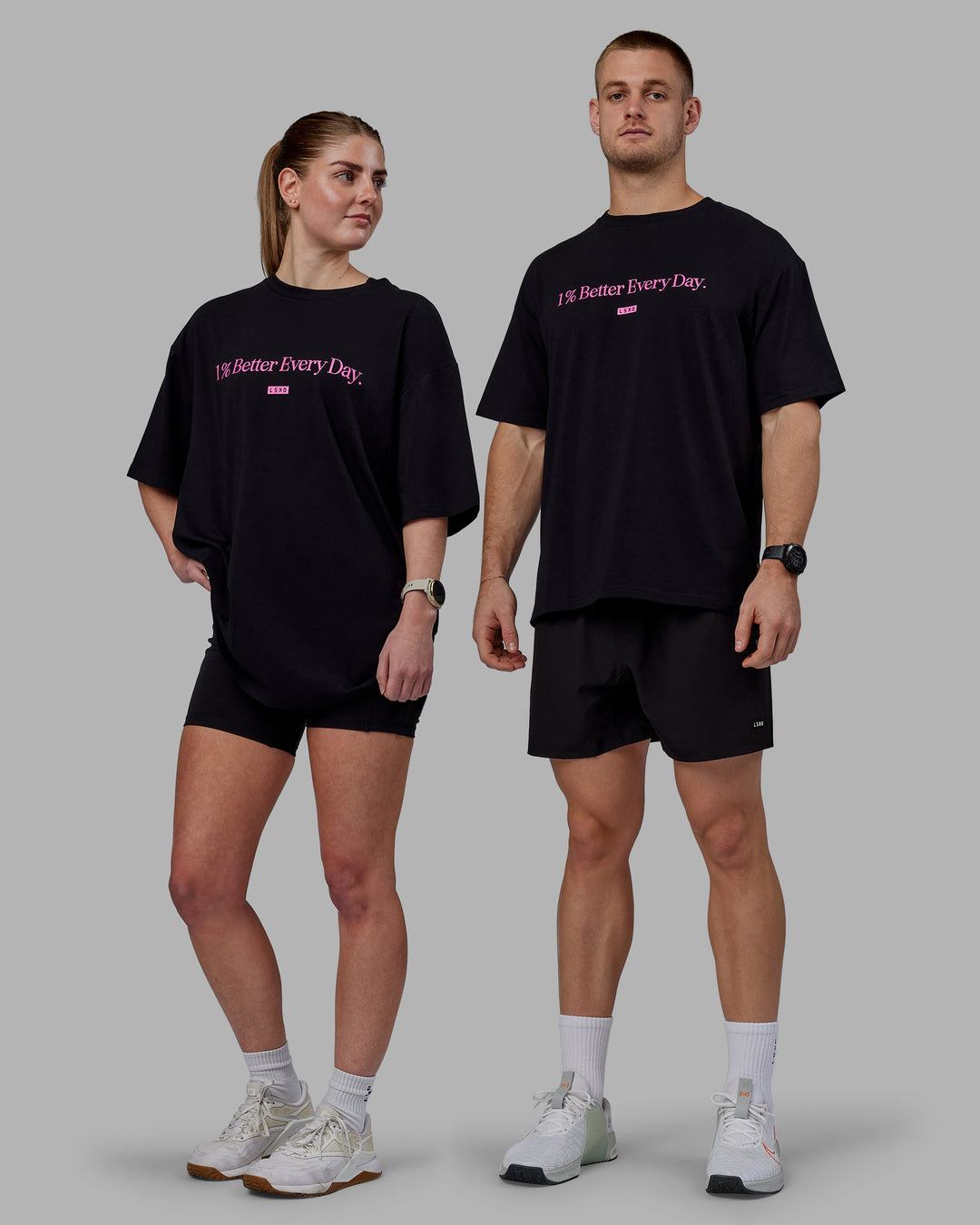 Duo wearing Unisex 1% Better FLXCotton Tee Oversize - Black-Fuschia Pink