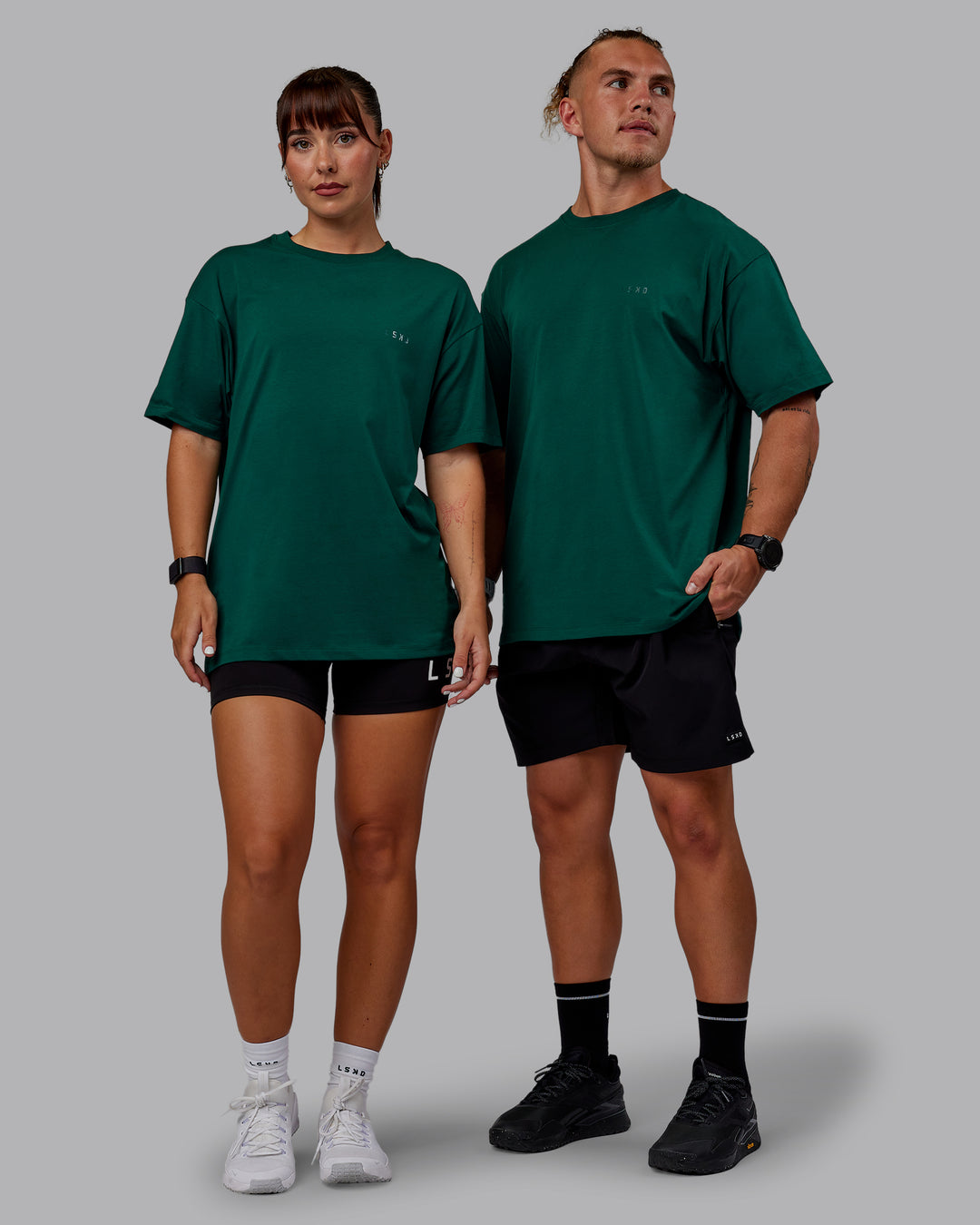 Duo wearing Unisex Deluxe PimaFLX Tee Oversize - Deep Emerald