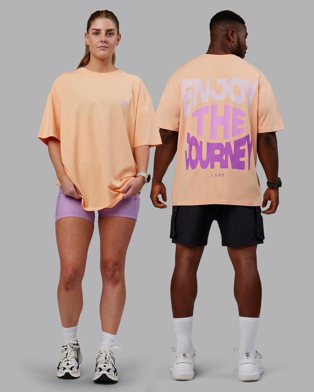 Duo wearing Unisex E.T.J FLXCotton Tee Oversize - Peach Fuzz-Purple